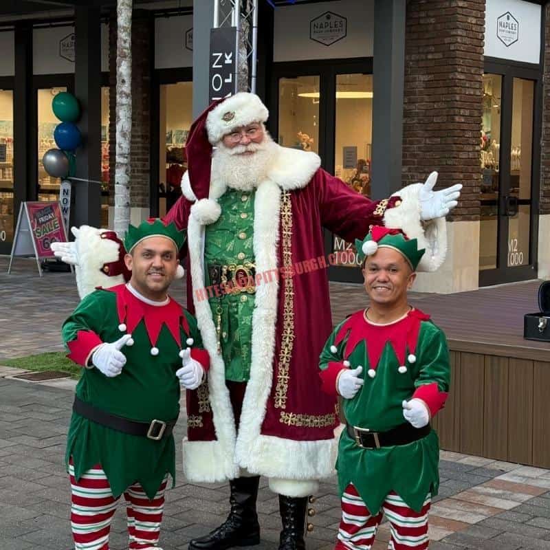 Santa helpers – Santa with two little people elves in green and red striped costumes
