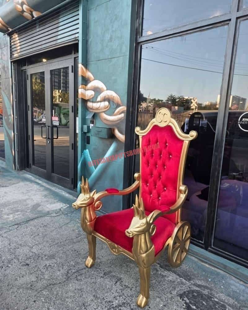 Gold and red velvet Santa throne with carved reindeer, available for Santa visits in Mt. Lebanon